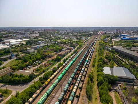 High angle drone shot captures numerous freight trains with colorful cargo wa Fotos de archivo