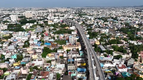 A high-angle drone shot capturing the elevated Chennai Metro Rail track as it Video stock 318279954