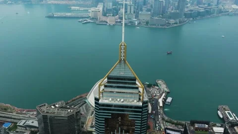 High angle drone shot circling the Central Plaza tower in Hong Kong, overcast Stock Footage 340199198