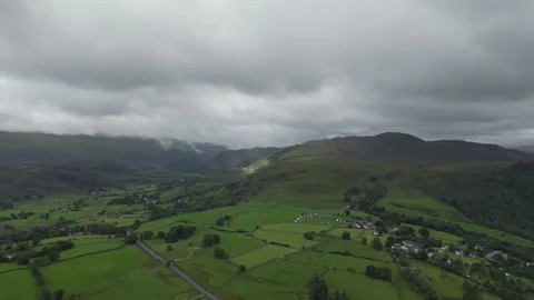 A high angle drone shot of the English countryside in the summer. Stock Footage 275933377