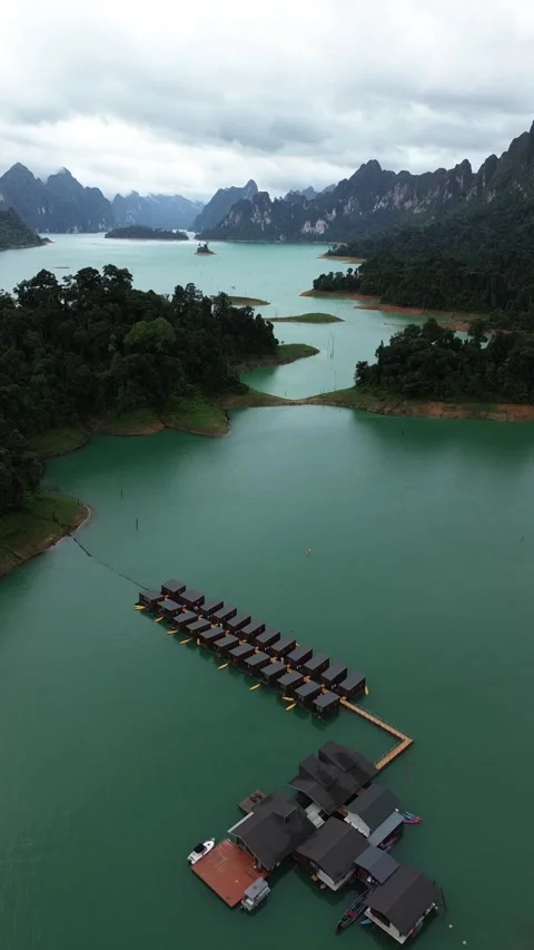 High angle drone shot of floating resort on Cheow Lan Lake Stock Footage 336486554