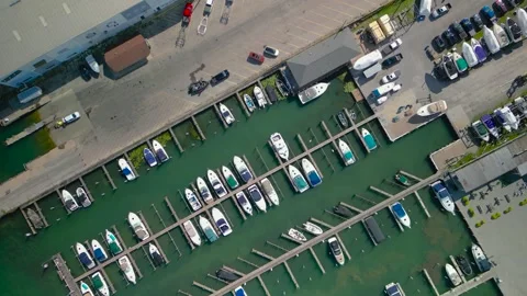 High angle drone shot flying over a harbor filled with many luxury yachts, .. Video stock 329663504