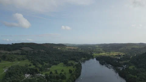 A high angle drone shot of a lake and a village in England. 스톡 동영상 248622372