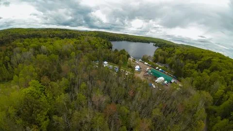 High angle drone shot looking across an inland marina toward a northern lake Foto stock