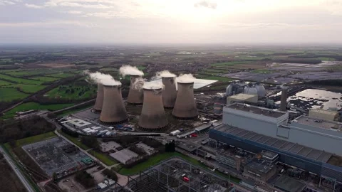 High-angle drone shot of a massive electric utility facility and steam Video stock 339047317