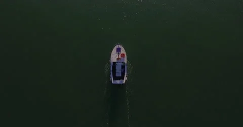 High angle drone shot over boat in water Stock Footage 68933630