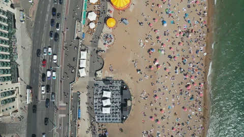 A high angle drone shot of tourists on the beach in summer. Stock Footage 263487119