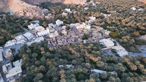 A high-angle drone shot of the Wilayat of Izki, showing both old and modern  Stock Footage 337874192