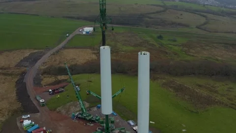 High Angle drone shot of a wind turbine construction, 4K Stock Footage 179335891