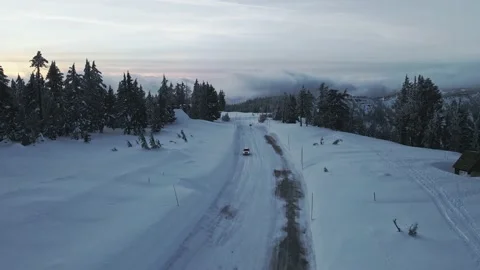 High angle drone shot of winter road, car and a hut, Crater Lake, Oregon, USA Stock Footage 185267445