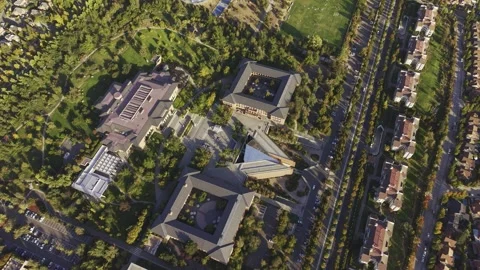 High-angle drone sweep flying over the gardens and central plaza at Universidad Stock Footage 332559347