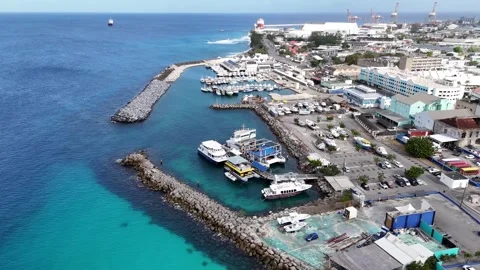 High angle drone tracking shot of a commercial cargo harbor and industrial 動画素材 336695781