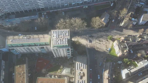 High angle drone video of a city with buildings and traffic. Stock Footage 300836843