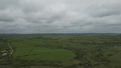 A high angle drone video of green farmlands in Cornwall. Stock Footage 276489672