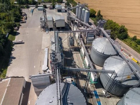 High Angle Drone View of Agricultural Processing Facility and Grain Silos Stock Photos
