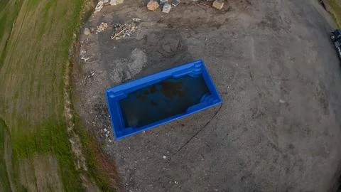 High angle drone view of a blue fiberglass swimming pool shell Foto stock