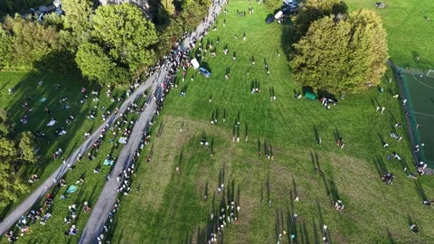 High-angle drone view of crowd in hot air balloon festival in Ireland. Stock Footage 346106271