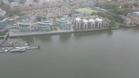 A high angle drone view of a dense urban area by a river. Stock Footage 289391285