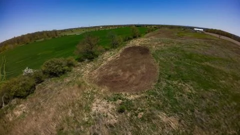 High angle drone view of a freshly tilled oval food plot Stock Photos