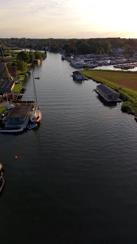 High-angle drone view of Kagerplassen canal at sunset in Warmond South Stock-Footage 347147105