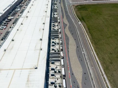 High angle drone view of a large data center and cooling units Stock Photos