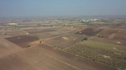 High angle drone view looking down on a patchwork of agricultural fields under Video stock 337093190
