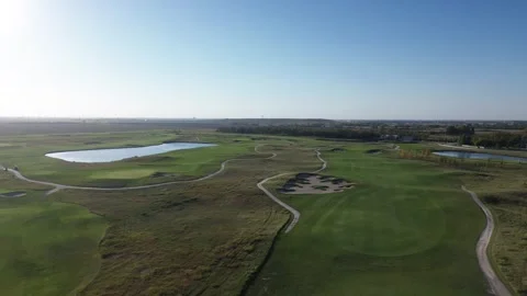 High-Angle Drone View of a Sprawling Golf Course Stock Footage 317967715