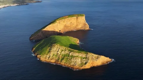 High angle drone view at sunset over iconic Cabras islets near Terceira, Azores 動画素材 328525261