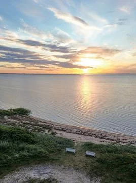 High angle drone view of two white benches on Hemmet beach at sunset Stock Photos