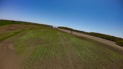 High angle drone view of a vast empty prepped farmfield Stock Photos