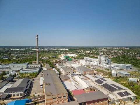 High angle drone viewpoint captures modern industrial facility zone with larg Fotos Stock