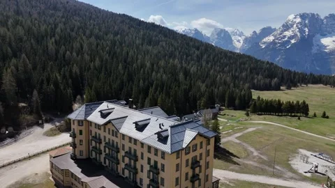 High Angle Establishing Drone Shot of Mountain Lake Settlement and Hidde Stock Footage 341074343