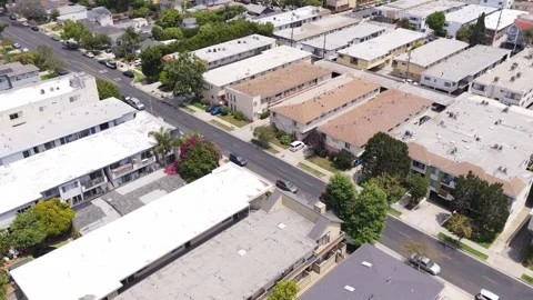 High angle establishing shot revealing low rise apartments and residential build Video stock 336634020