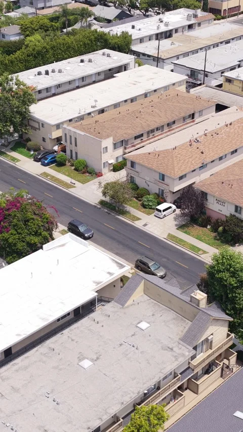 High angle establishing shot revealing low rise apartments and residential build Video stock 337318422