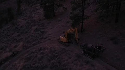 High Angle Evening Excavator Dragging Trammel Drone Shot Stock Footage 146553325