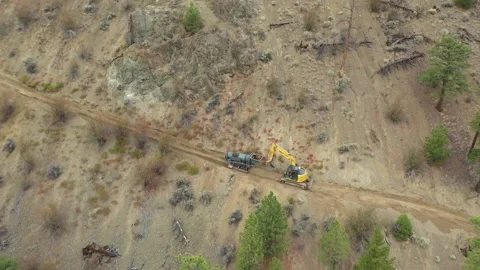 High Angle Excavator Dragging Trammel Drone Shot Stock Footage 146553302