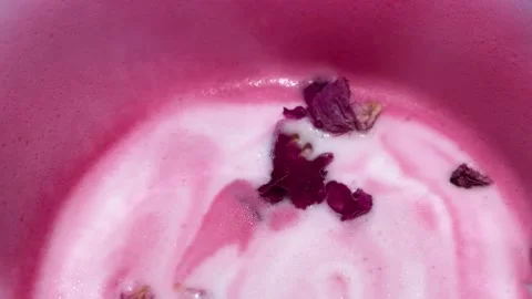 High Angle Extreme Close Up Of Pink Rose Latte Liquid With Rose Petal Видео 332662623
