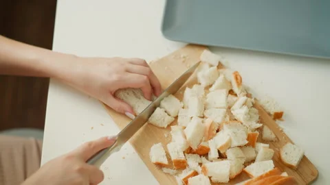 High Angle Female Hand Chopping Cake Slices On Board Stock Footage 307978512