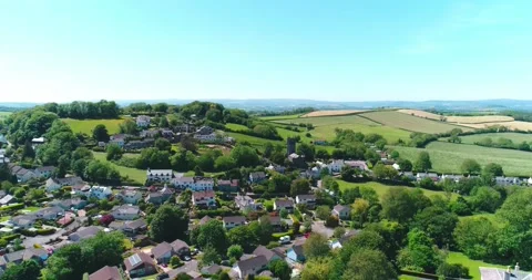 High angle flight over small town in Devon England towards Saint John the Video stock 155823690