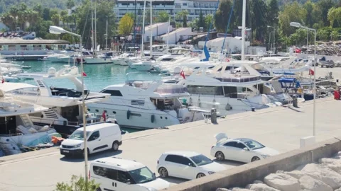 High-angle footage captures the contrast between a bustling, modern marina f 스톡 동영상 318862008
