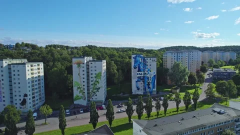High-angle footage of large-scale mural art on residential buildings in Stock Footage 327844070