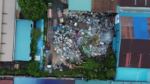 High-Angle Footage Showcasing a Densely Packed Urban Scrapyard Adjacent to .. Stock Footage 339035888