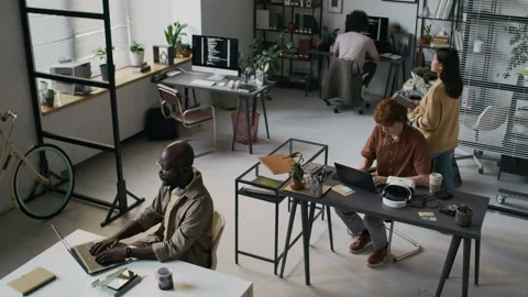 High Angle of Four Multi-Ethnic Programmers Working in Office of IT Company Stock-Footage 299301823