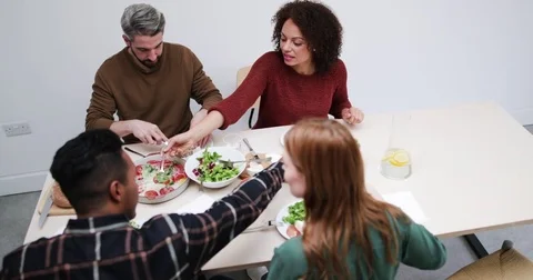 High angle friends enjoying a meal together Stock Footage 80789893