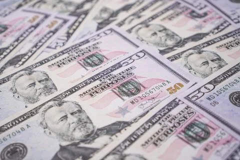 A high angle full frame background shot of United States fifty dollar bills . Stock Photos