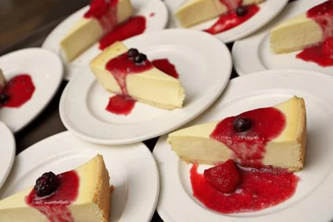 High Angle Full Frame Image of Plates of Cheesecake with Strawberry, Cherry and Stock Photos