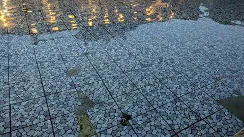High angle full frame shot captures ripples on clear water flowing over a g.. Stock Photos