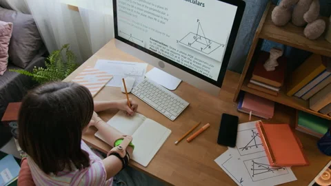 High Angle of Girl Taking Notes Studying Geometric Theorem on Computer Stock Footage 298618148