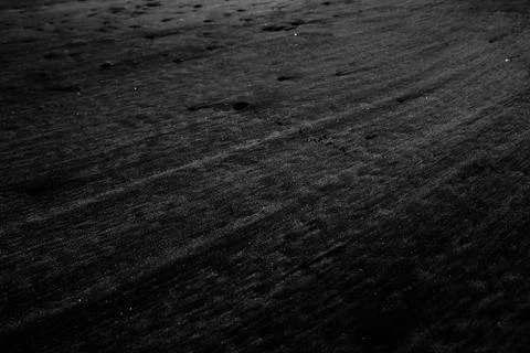 High angle grey scale shot of the patterns on the sand Fotos de archivo