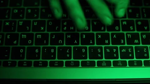 High angle hands typing text on keyboard under green light Stock Footage 229706377
